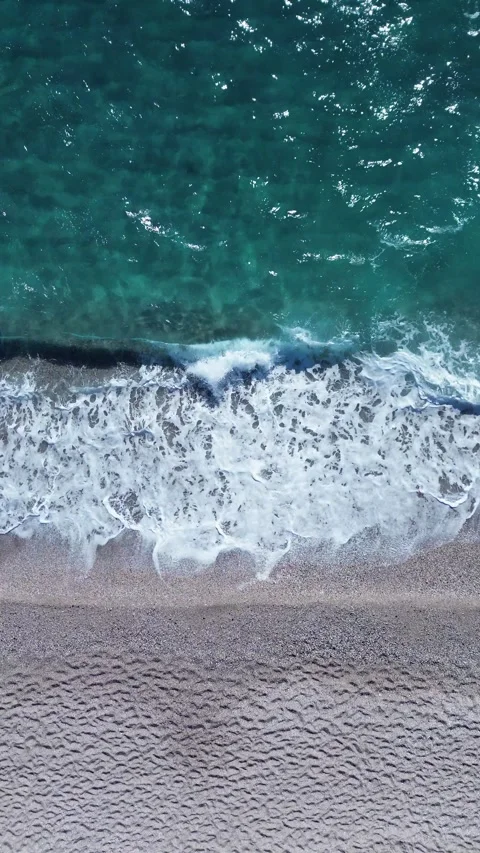 Beach shore breaking waves from above Stock Footage 275861522