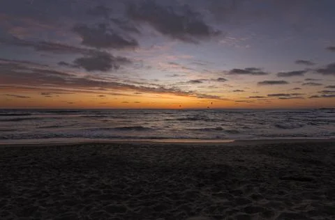 Beach on the shore during sundown Stock Photos