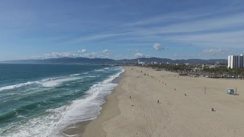 Beach shore push with waves and mountains Video stock 76138202