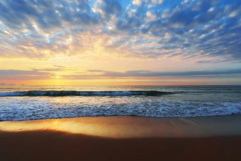 Beach shore at sunset Stock Photos