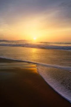 Beach shore at sunset Stock Photos