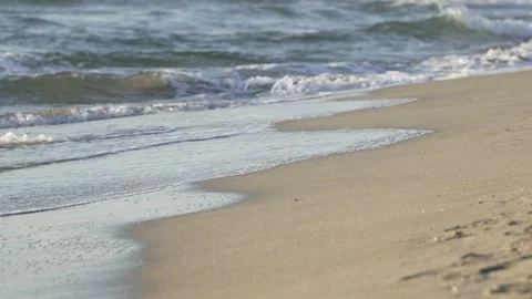 Beach shoreline with small slow motion waves Stock Footage 293932167