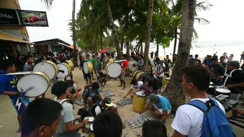 On the beach showcasing passionate drumming by a group of people Stock Footage 327552503