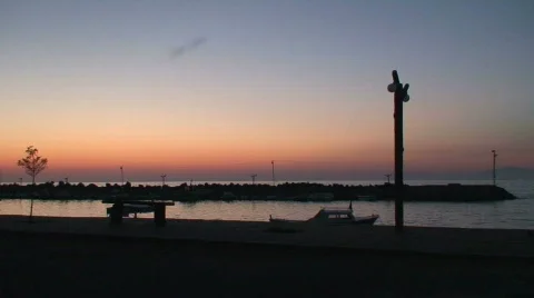 Beach side restaurant at sunset. HD 1080i Stock Footage 77708