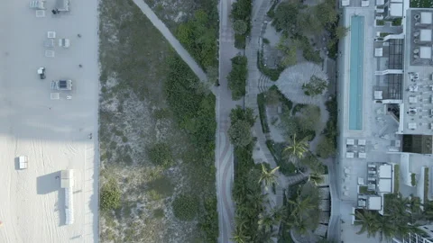 Beach sidewalk view from the sky Stock Footage 153888383