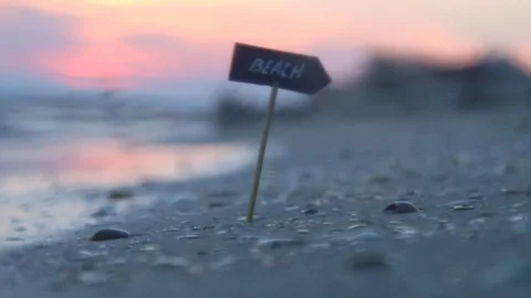 Beach sign, ocean coast, summer vacation idea Stock Footage