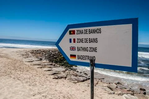 Beach sign in several languages Stock Photos