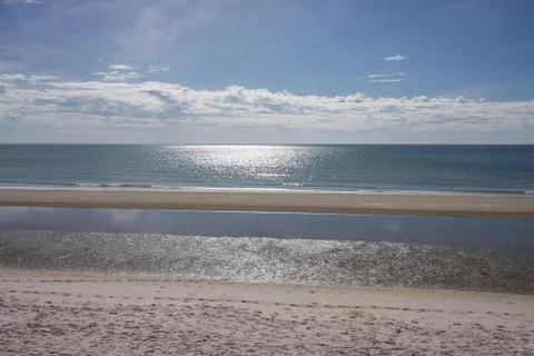 Beach sky and reflection Stock Photos