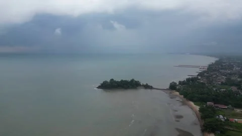 A beach with a small island in the middle of the ocean Видео 325831241