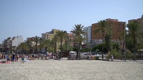 Beach by small town Stock Footage 128349756