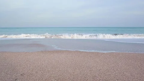 Beach of small waves of turquoise water. Stock Footage 150771764