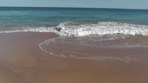 Beach smooth tides blue sky Stock Footage 52317610