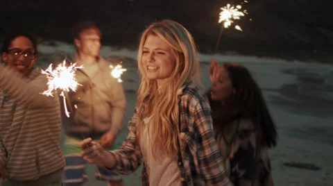 Beach sparkler fun 스톡 동영상 64564013