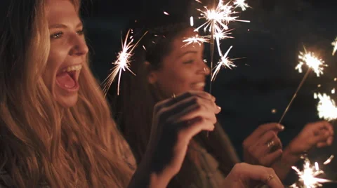 Beach sparkler fun Stock Footage 64564163