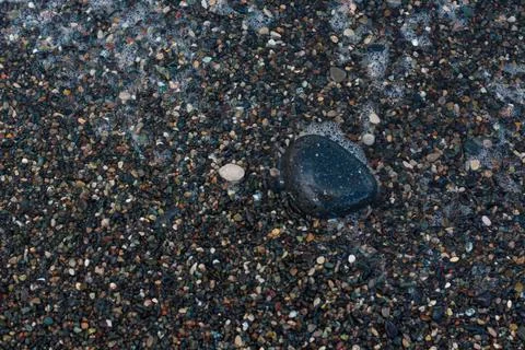 Beach stone pebbled wet background Stock Photos
