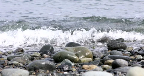 Beach stones covered with waves Stock Footage 183319444