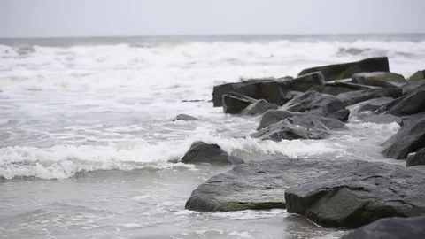 Beach storm surf over jetty Stock Footage 75770005