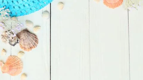 Beach straw hat and seashells on a wooden background.photo with place for text Stock Photos
