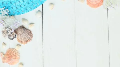 Beach straw hat and seashells on a wooden background.photo with place for text Stock Photos