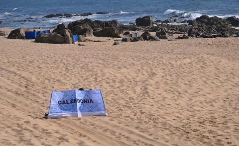 Beach on a summer day with a wind shield mounted Stock Photos