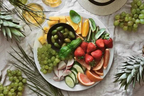Beach summer table setting with fruits and veggies Stock Photos