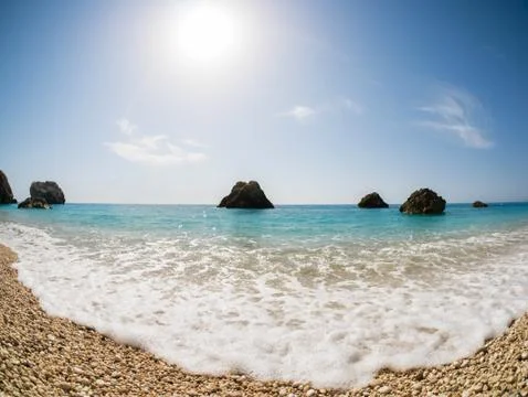 Beach with sun Stock Photos