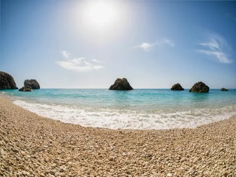 Beach with sun Stock Photos