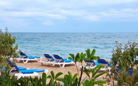 Beach with sunbeds Fotos de archivo