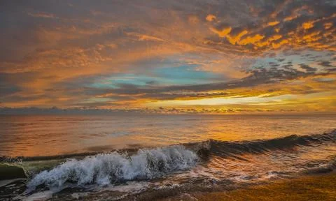 Beach at sunrise Stock-Fotos