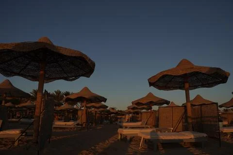 Beach at sunrise Stock Photos