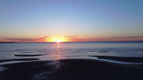 Beach Sunset Aerials moving righto left with sand foreground 4K Stock Footage 152493931