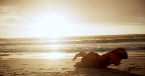 Beach, sunset and dinosaur running or fall, inflatable or comic at vacation Stock-Footage 271365091