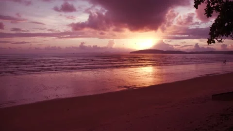 On the beach, sunset and sky under dense clouds, Sunlight reflect on water Stock Footage 153507284