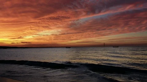 Beach Sunset Behind the Waves Stock Footage 120491306