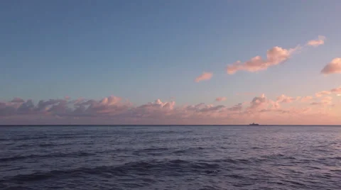 Beach At Sunset With Clouds At The Horizon - Pan Stock Footage 37208540