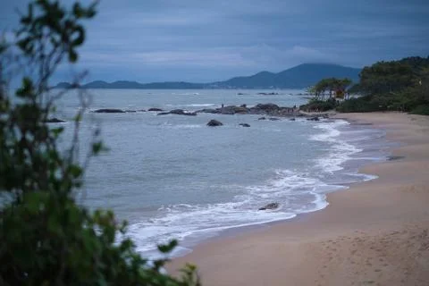 The beach at sunset clouds Stock Photos