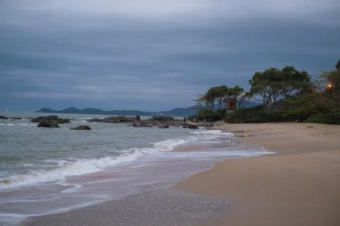 The beach at sunset clouds Stock Photos