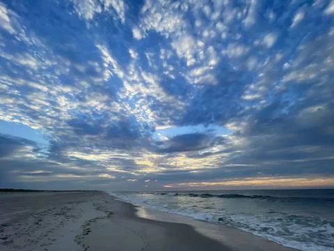 Beach at Sunset with Dramatic Sky Stock Photos