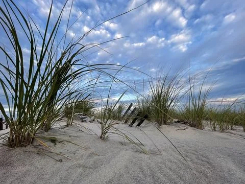 Beach at Sunset with Dramatic Sky Stock Photos