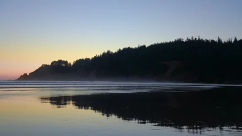 Beach Sunset with Mountain Silhouette, Oregon, Pacific Northwest Stock Footage 341366501