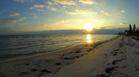 BEACH, SUNSET OVER WATER Stock Footage 37154174