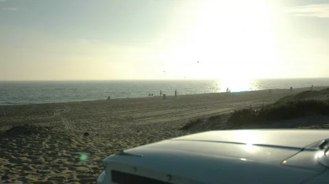 Beach Sunset Overlooking Classic Car Hood Stock Footage 790952