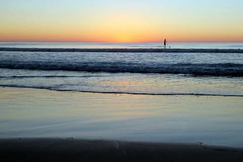 Beach Sunset with Paddler Stock Photos