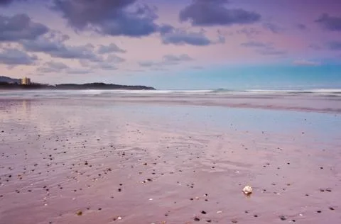 Beach at sunset Stock Photos