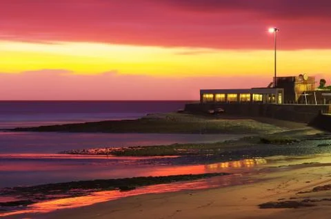 Beach at sunset Stock Photos