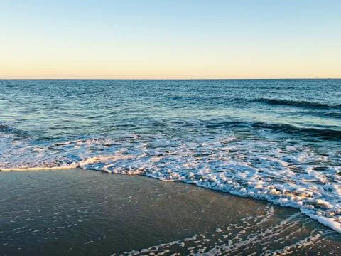 Beach at sunset Stock Photos