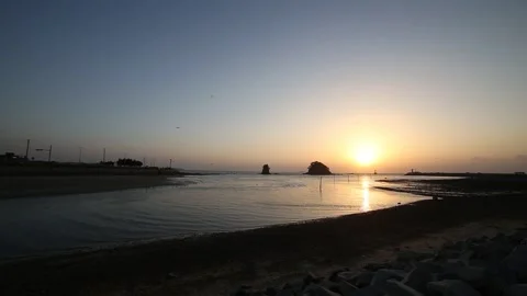 Beach at sunset, sunset reflected at ocean Stock-Footage 303391161