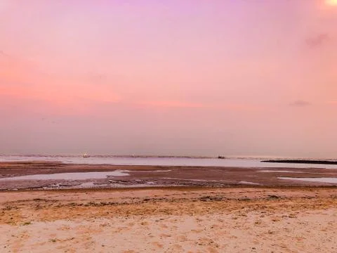 Beach in sunset time with clear sky background Stock Photos