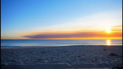 Beach at sunset time-lapse smoke on horizon Stock Footage 108726594