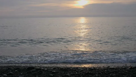 Beach at sunset, the wave hits the shore Stock-Footage 104518246